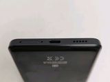 a close up of the back of a black cell phone