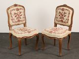 pair of antique chairs with floral upholstered upholstered backs