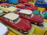 many toy cars that are on display on a table