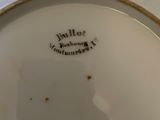a close up of a white plate with a yellow border