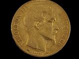 l'image d'une pièce d'or sur laquelle figure le visage d'un homme