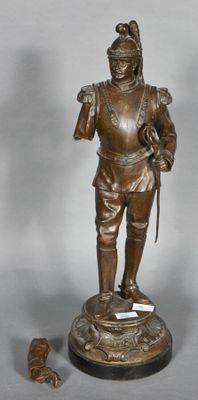 bronze figurine of a man with a dog on a pedestal