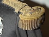 an image of a military uniform with a medal on it