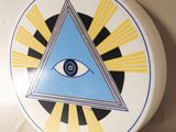 an image of a decorative plate with an all seeing eye on it