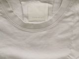 a white t - shirt with a black and white logo on it