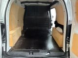 a white van with a bed in the back of it