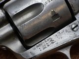 a gun that is on the ground with a tag on it