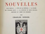 an old book with a picture of a man and a woman on it
