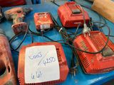 a lot of power tools on a table with a price tag