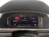the dashboard of a car with a digital display in the center