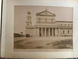 an old picture of a church with a clock tower