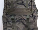 the back of a camouflage backpack with two straps on it
