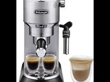 a close up of a coffee machine with two cups of coffee