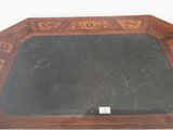 a table with a black marble top and a wooden frame