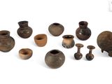 many different types of vases on a white surface