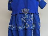 an image of a blue dress on a mannequin