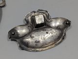 a silver object that is sitting on a table