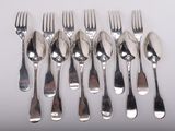 six forks and six knives are arranged in a row