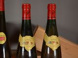 three bottles of wine sitting next to each other on a table