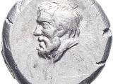 a close up of a coin with a man ' s face on it