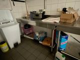 a kitchen with a sink and a refrigerator in it
