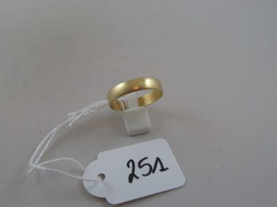 a gold ring with a price tag attached to it
