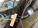 a sticker on the windshield of a car that is parked in a garage