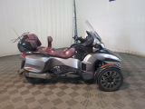 a silver and black motorcycle parked in a room