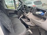 the interior of a van with the door open and the driver ' s seat down