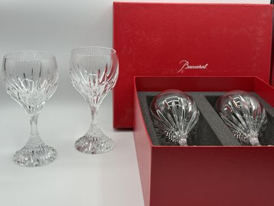 three wine glasses in a red box on a table