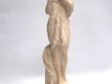 statue of a woman holding a dog on a white background