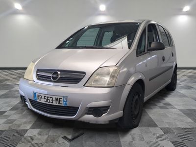 a picture of a silver car parked in a garage