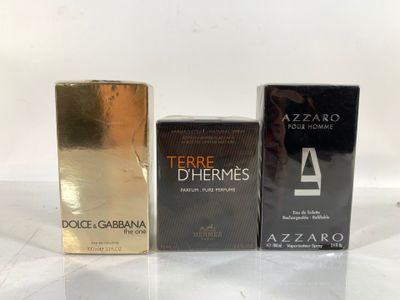three different types of perfumes sitting on a table