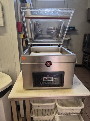 a machine that is sitting on a table in a kitchen