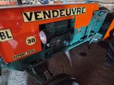a tractor that is parked in a garage