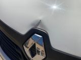 a close up of a car ' s emblem on the front of the car