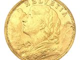 a close up of a gold coin on a white background