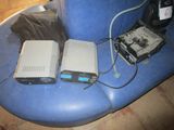 two computers sitting on a blue leather chair