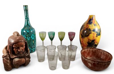 a group of glassware and a vase on a white surface