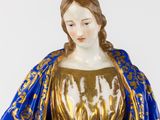 an image of a statue of a woman wearing a blue robe