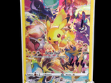 the pokemon card is displayed on a stand in front of a black background