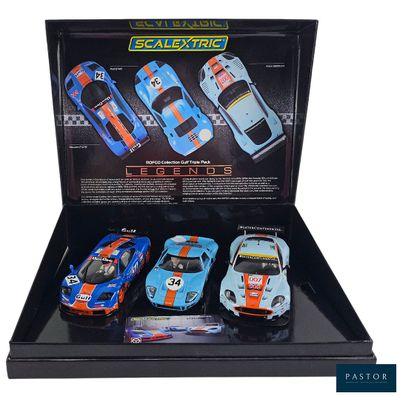 a close up of a display case with four toy cars in it