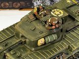 a model of a tank on a table with a picture in the background