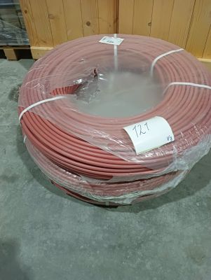 a large roll of red electrical wire wrapped in plastic