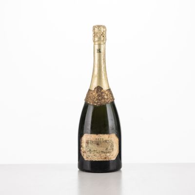 a bottle of champagne sitting on top of a table