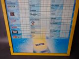 a picture of a menu board with a picture of a bottle of beer