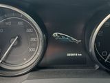 a close up of a car ' s dashboard with a speedometer