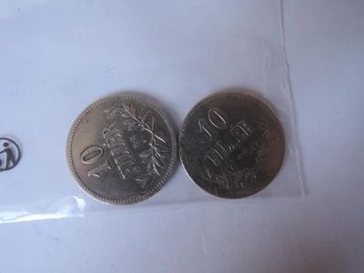two coins sitting next to each other on a table