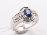 an image of a sapphire and diamond ring on a white background