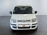 a white car that is parked in a room